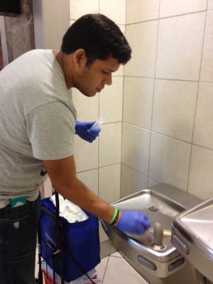 <p>CGSW lab student taking swab samples of water fountains at Hartsfield Atlanta Airport.</p>
