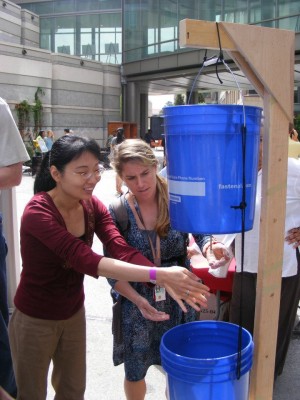 <p>Rollins students testing out a hand-washing station</p>
